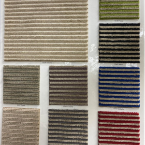 Modern striped carpet and woven wool carpet samples displayed in Designer's Carpet One showroom